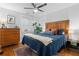 Cozy bedroom with a wooden headboard, blue bedding, and natural light from the windows at 1963 Main Nw St, Atlanta, GA 30318