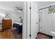 An entrance to a bedroom with hardwood floors, a ceiling fan, and natural light coming through the windows at 1963 Main Nw St, Atlanta, GA 30318
