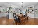 Stylish dining room with modern lighting, hardwood floors, and open view to kitchen at 1963 Main Nw St, Atlanta, GA 30318