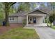 Charming single-story home with a covered carport and well-maintained front lawn at 1963 Main Nw St, Atlanta, GA 30318