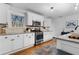 Modern kitchen with white cabinets, stainless steel appliances, and granite countertops at 1963 Main Nw St, Atlanta, GA 30318
