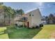 Large backyard with a spacious wooden deck and covered patio for outdoor enjoyment at 240 Arthurs Ln, Covington, GA 30016