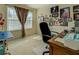 Bright bedroom featuring a window and a desk, perfect for a home office at 240 Arthurs Ln, Covington, GA 30016