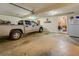 Open and unfinished garage space with a silver truck parked inside at 240 Arthurs Ln, Covington, GA 30016
