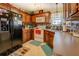 Traditional kitchen with stainless steel refrigerator and wood cabinets at 240 Arthurs Ln, Covington, GA 30016