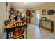 Eat-in kitchen with stainless appliances, dark wood cabinets, and a door to the outside at 240 Arthurs Ln, Covington, GA 30016