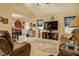 Open concept living room featuring a vaulted ceiling and seamless flow to the kitchen and dining area at 240 Arthurs Ln, Covington, GA 30016