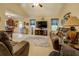 Spacious living room adjacent to kitchen featuring comfortable seating and decor at 240 Arthurs Ln, Covington, GA 30016