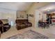 Inviting living area with comfortable seating, vaulted ceiling, and view to the kitchen at 240 Arthurs Ln, Covington, GA 30016