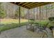 Under-deck patio with seating area at 240 Arthurs Ln, Covington, GA 30016