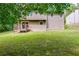 The house features a large, grassy backyard, ideal for outdoor activities and relaxation at 4558 Dorsett Shoals Ct, Douglasville, GA 30135