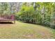 Spacious backyard with a deck and views of the woods at 4558 Dorsett Shoals Ct, Douglasville, GA 30135