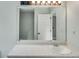 Bathroom vanity with sink and a large mirror at 4558 Dorsett Shoals Ct, Douglasville, GA 30135