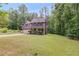 Charming home featuring a lush green lawn and a welcoming front porch perfect for relaxing outdoors at 4558 Dorsett Shoals Ct, Douglasville, GA 30135