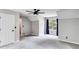 Expansive main bedroom featuring neutral carpet, and a modern ceiling fan at 4558 Dorsett Shoals Ct, Douglasville, GA 30135