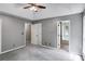 Main bedroom with large closet doors and a bathroom entrance at 4558 Dorsett Shoals Ct, Douglasville, GA 30135