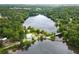Stunning aerial view of a lake community featuring a swimming pool and lush green surroundings at 131 Cypress St, Roswell, GA 30075