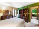 Spacious bedroom with a natural color scheme, a large window, and stylish furnishings at 131 Cypress St, Roswell, GA 30075