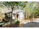 Charming home exterior showcasing a wooden deck, ramp access, and a quaint setting at 131 Cypress St, Roswell, GA 30075