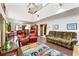 Inviting living room with high ceilings, skylights, brick flooring, and comfortable seating at 131 Cypress St, Roswell, GA 30075