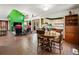 Expansive living room with brick floors, vaulted ceilings and view of the modern kitchen at 131 Cypress St, Roswell, GA 30075