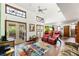 Bright living room with vaulted ceilings, skylights, brick floors, and sliding door access to the deck at 131 Cypress St, Roswell, GA 30075