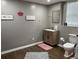 Well-lit bathroom with a single vanity, pink accents, and a clean, modern design at 1380 Cedar Hl, Douglasville, GA 30134