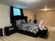 Comfortable bedroom with cozy bedding and a neutral color scheme, perfect for relaxation at 1380 Cedar Hl, Douglasville, GA 30134