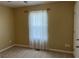 Bright bedroom features neutral walls, carpeted floor, window with sheer curtains and a ceiling fan at 1380 Cedar Hl, Douglasville, GA 30134