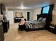 Cozy bedroom featuring dark furniture, plush bedding, and plenty of space for relaxing at 1380 Cedar Hl, Douglasville, GA 30134