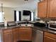 View of the kitchen and living room with stainless steel appliances and a seamless open design at 1380 Cedar Hl, Douglasville, GA 30134