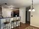 Kitchen features a breakfast bar with stools, modern lighting, and an open layout, perfect for casual dining at 1380 Cedar Hl, Douglasville, GA 30134