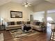 Bright and airy living room with a sectional sofa, area rug, fireplace, and open layout for modern living at 1380 Cedar Hl, Douglasville, GA 30134
