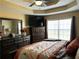 Comfortable main bedroom features a large bed, dressers, tv, and window at 1380 Cedar Hl, Douglasville, GA 30134