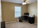 This home office has a window, ceiling fan, desk, and a carpeted floor at 1380 Cedar Hl, Douglasville, GA 30134