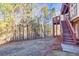 Backyard featuring a wood deck with steps and wooded landscape at 1526 Rocky River Dr, Lawrenceville, GA 30045