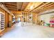 Unfinished basement with concrete floors and exposed ceiling joists at 1526 Rocky River Dr, Lawrenceville, GA 30045
