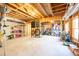 Unfinished basement featuring exposed ceiling joists and concrete flooring at 1526 Rocky River Dr, Lawrenceville, GA 30045