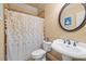 Charming bathroom with decorative shower curtain and vanity at 1526 Rocky River Dr, Lawrenceville, GA 30045