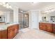 Elegant bathroom featuring double vanity and walk-in glass shower at 1526 Rocky River Dr, Lawrenceville, GA 30045