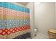 Bathroom featuring a decorative shower curtain, neutral paint, and tiled floor at 1526 Rocky River Dr, Lawrenceville, GA 30045