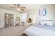A bedroom features carpet, a ceiling fan, and a cozy egg chair at 1526 Rocky River Dr, Lawrenceville, GA 30045