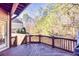 Deck with wood flooring and railings, and views of the backyard at 1526 Rocky River Dr, Lawrenceville, GA 30045