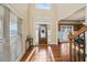 Elegant foyer featuring hardwood floors, a decorative front door, and ample natural light at 1526 Rocky River Dr, Lawrenceville, GA 30045