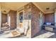 Covered front porch area with decorative stone and brickwork, perfect for relaxing or greeting guests at 1526 Rocky River Dr, Lawrenceville, GA 30045