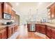 Charming kitchen showcasing granite countertops, stainless steel appliances, and custom wood cabinets at 1526 Rocky River Dr, Lawrenceville, GA 30045