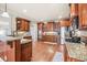 Gourmet kitchen featuring granite countertops, stainless steel appliances, and custom wood cabinetry at 1526 Rocky River Dr, Lawrenceville, GA 30045
