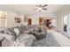 Inviting living room featuring a comfortable sectional sofa and an open layout at 1526 Rocky River Dr, Lawrenceville, GA 30045
