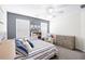 A bedroom featuring carpet flooring, ceiling fan, and a dresser at 5081 Stone Moss Way, Hoschton, GA 30548