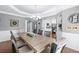 Dining room area boasting trey ceiling, chandelier lighting, and stylish decor, with hardwood floors at 5081 Stone Moss Way, Hoschton, GA 30548